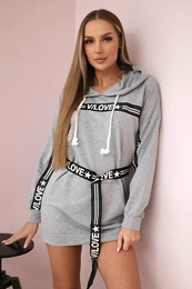 Dress decorated with a tape with gray inscriptions