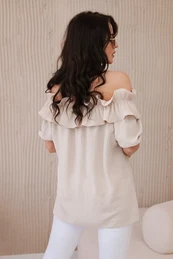 Spanish blouse with a decorative ruffle in beige color