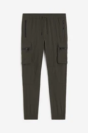 H&M Cargojoggers aus Nylon Skinny Fit Dunkles Khakigrün, Gepäck in Größe S. Farbe: Dark khaki green