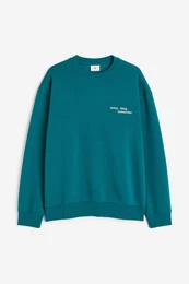 H&M Bedrucktes Sweatshirt in Loose Fit Blaugrün/Connected, Sweatshirts Größe XS. Farbe: Teal/connected