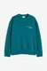 H&M Bedrucktes Sweatshirt in Loose Fit Blaugrün/Connected, Sweatshirts Größe XS. Farbe: Teal/connected