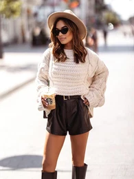 Ecru sweater with a weave of braids