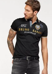 Poloshirt krpernahe Passform, mit Stickereien und Badges, Polokragen