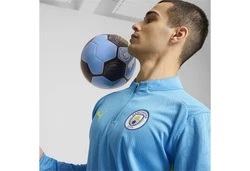 PUMA T-Shirt Manchester City Trainingsoberteil Hellblau