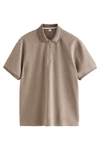 Next Poloshirt mit vertikalen Streifen Braun/Beige