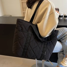 A Spacious And Casual Solid Color Tote Bag For Women, Featuring A Stylish Black Rhinestone Quilted Handbag. It Has A Polyester Lining And Of